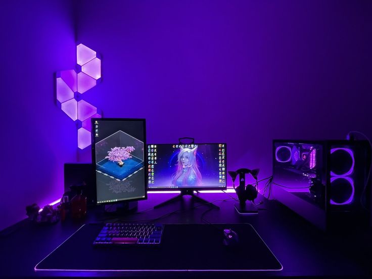 Futuristic dark-themed gaming desktop workstation setup with purple lighting